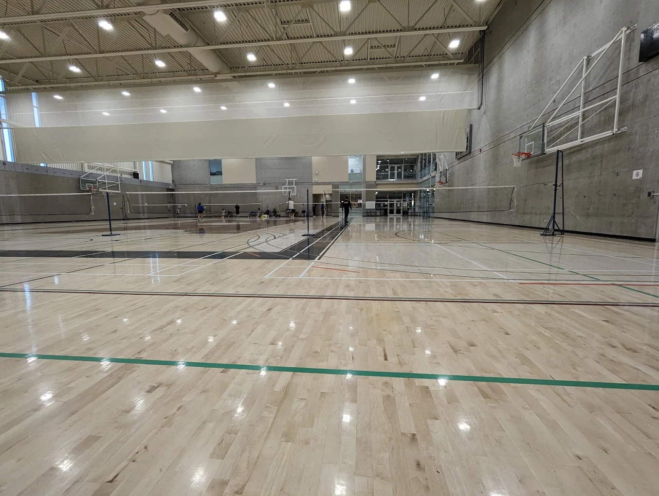 Indoor sports hall with court markings and high ceilings